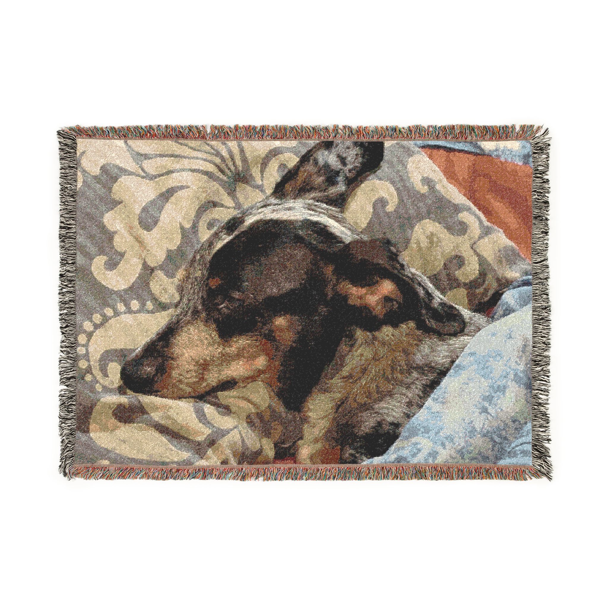 Woven cotton blanket featuring a sleeping dog among layered ornamental patterns